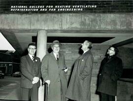 Hubert Secretan with guests outside building